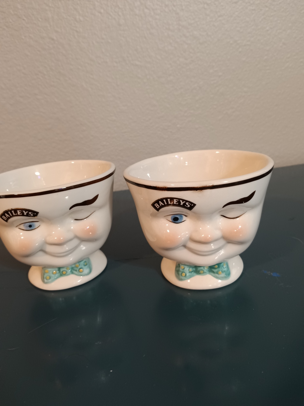Baileys Winking Face Ceramic Cups in Cream with Teal Bow